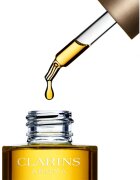 Clarins Lotus Treatment Oil регенериращо масло с изглаждащ ефект дневен и нощен 30 мл.