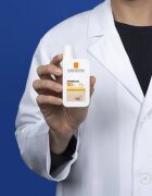 La Roche-Posay Anthelios UVMUNE 400 защитна тонирана течност за лице SPF 50+ 50 мл.
