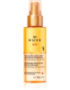 Nuxe Sun Moisturizing Protective Milky Oil For Hair защитно масло за коса увредена от слънце хлор и солна вода 100 мл.
