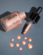Rodial Blush Drops течен руж и блясък за устни придаващ хидратация и блясък цвят Sunset Kiss 15 мл.
