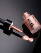 Rodial Blush Drops течен руж и блясък за устни придаващ хидратация и блясък цвят Sunset Kiss 15 мл.