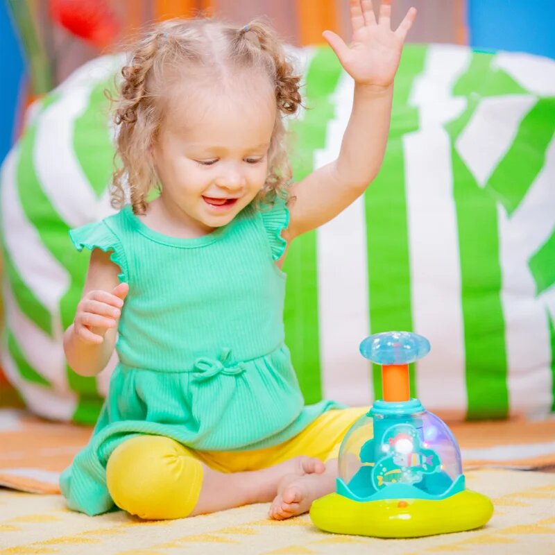 Bright Starts Press & Glow Spinner играчка за подреждане с мелодия 6 m+ 1 бр.