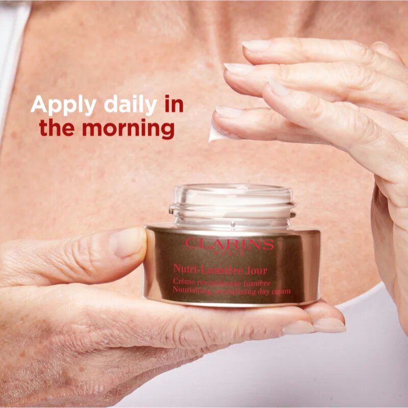 Clarins Nutri-Lumière Day ревитализиращ дневен крем за сияен вид на кожата 50 мл.