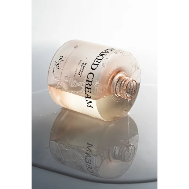 KUNDAL Objet Moist Gleam Body Wash парфюмиран душ гел за интензивна хидратация с аромат Naked Cream 450 мл.