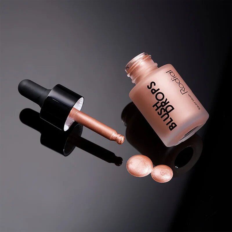 Rodial Blush Drops течен руж и блясък за устни придаващ хидратация и блясък цвят Sunset Kiss 15 мл.